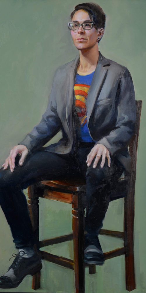 Realistic full fgure oil portrait of bespectacled young woman in gray sport coat and superhero t-shirt on a wooden chair gazing at us