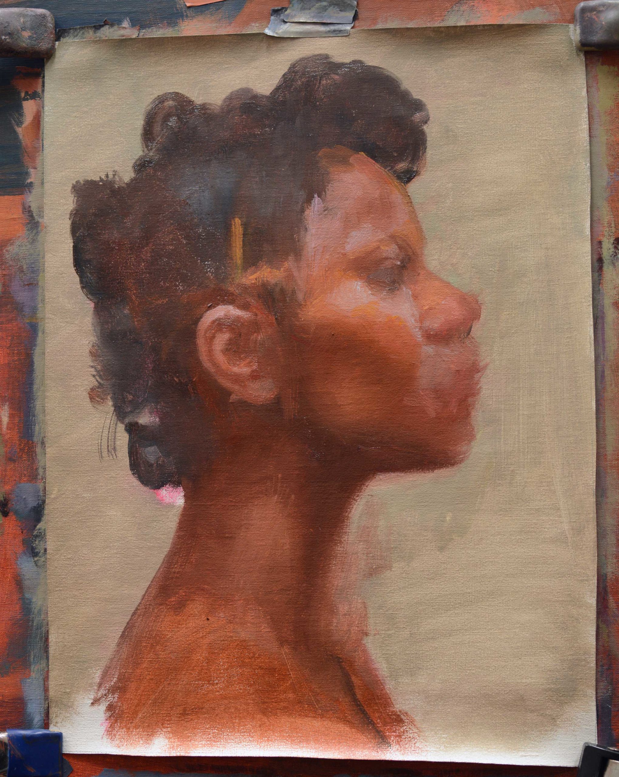 oil painted portrait of head in profile with colors being applied more carefully to give form